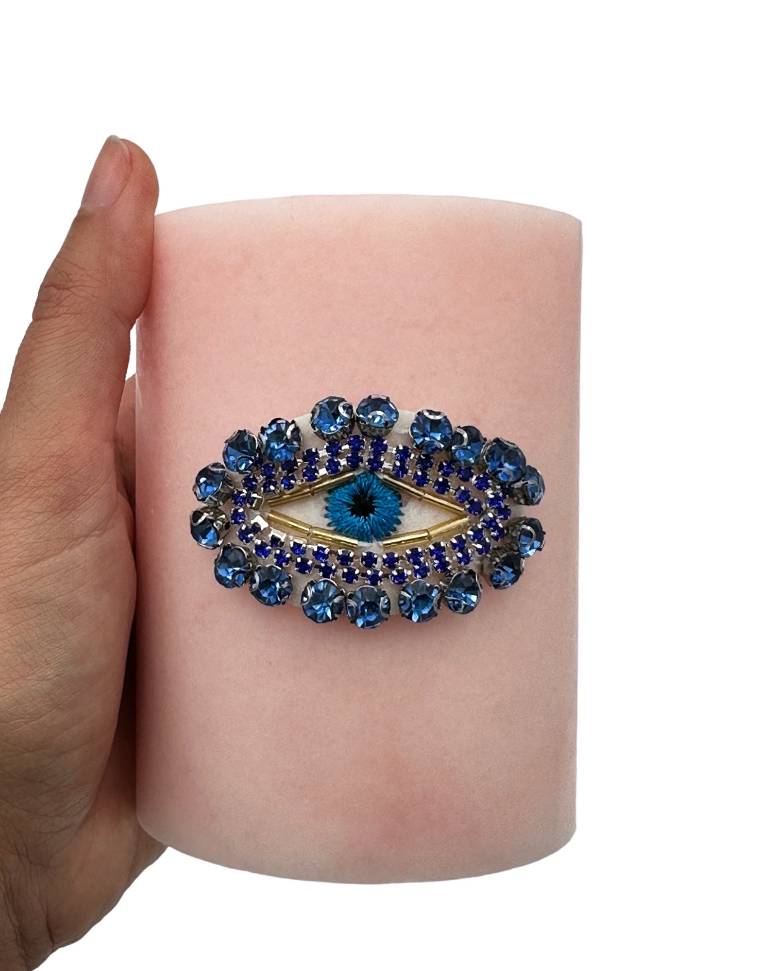 Pink candle with Blue Evil Eye